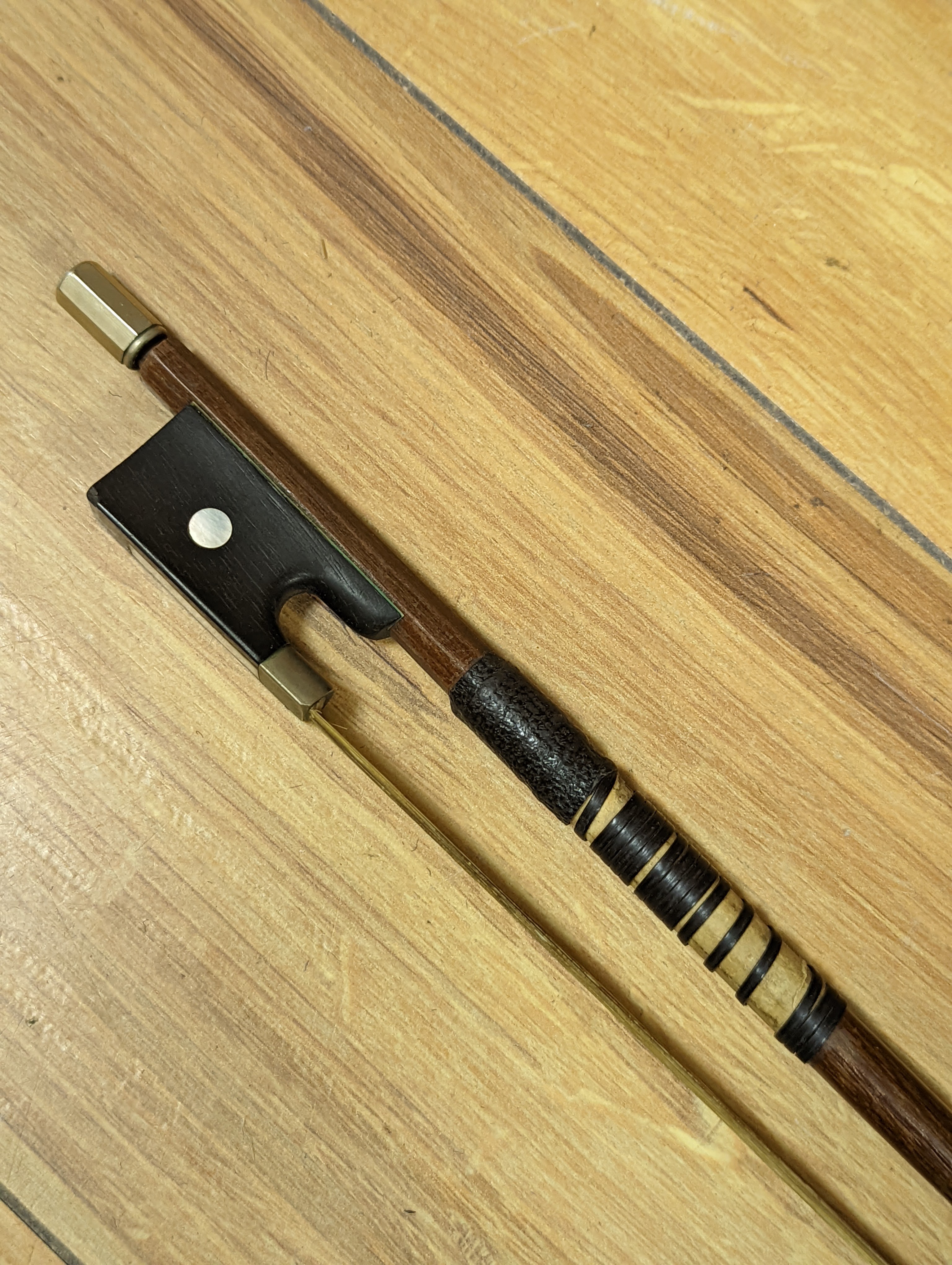 An early 20th century French vioilin, cased with bow and a cased saxon violin
